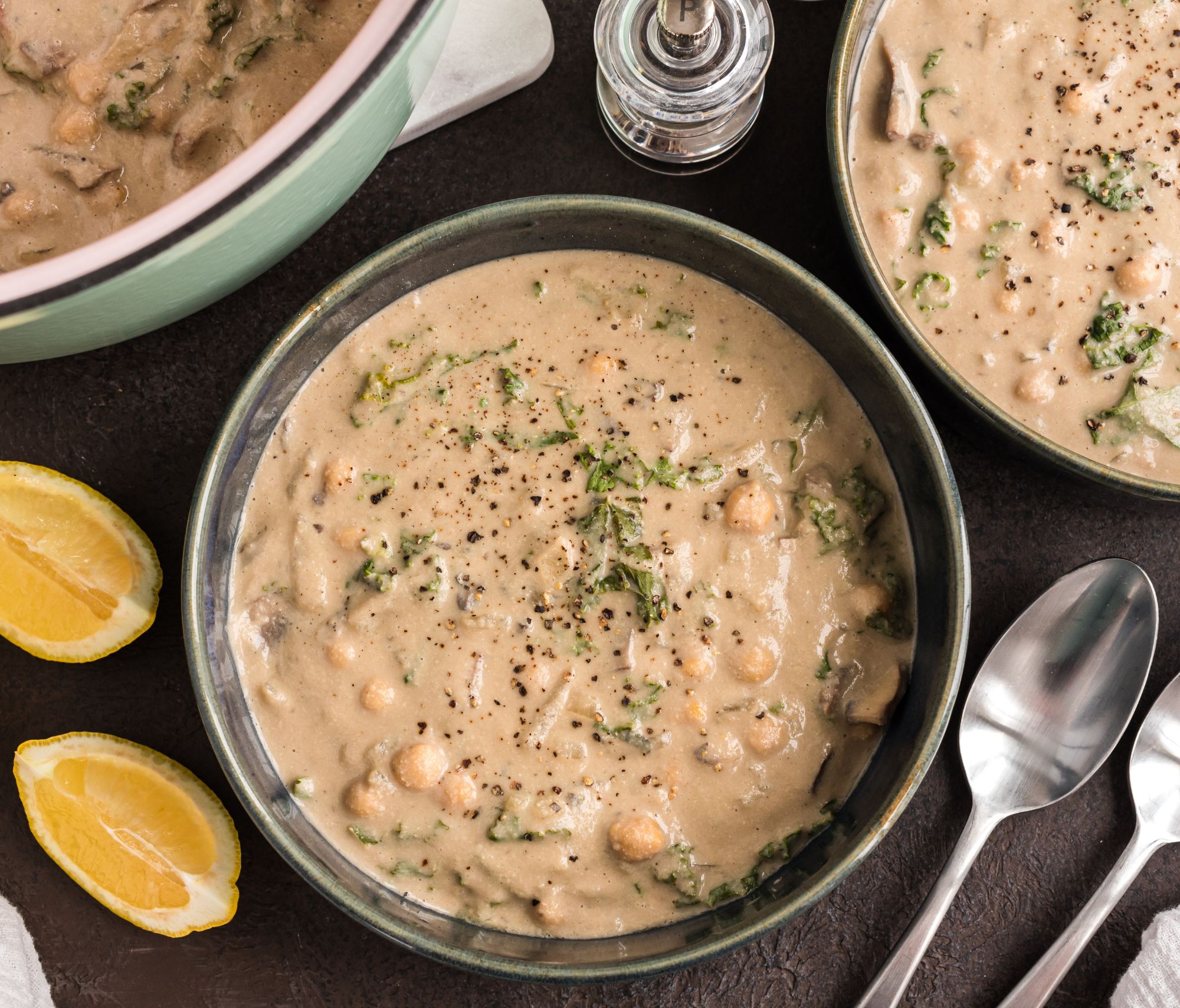 Creamy Mushroom Soup with Chickpeas and Kale on a dining table