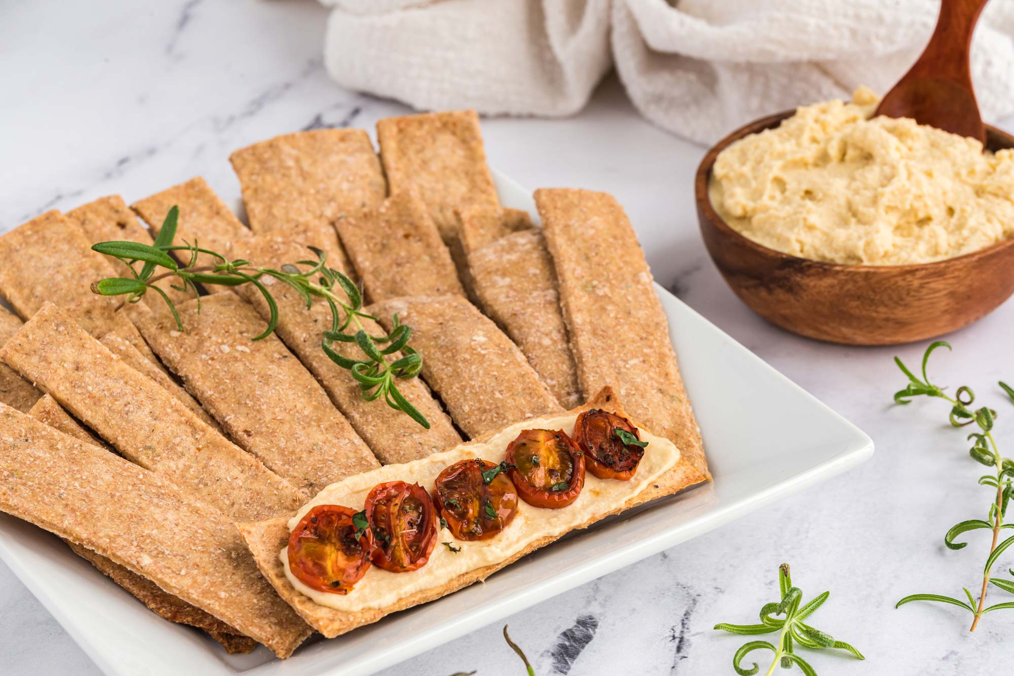 crispy rosemary cracker thins on plate