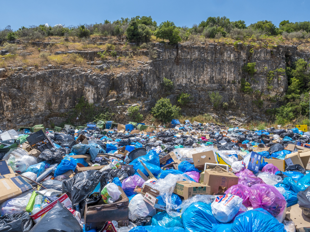 A huge pile of garbage in nature. Pollution concept.