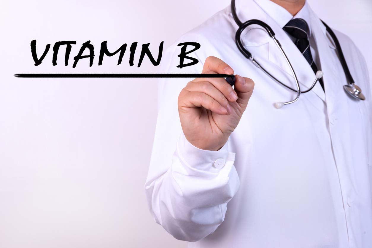 doctor writing vitamin b words with marker