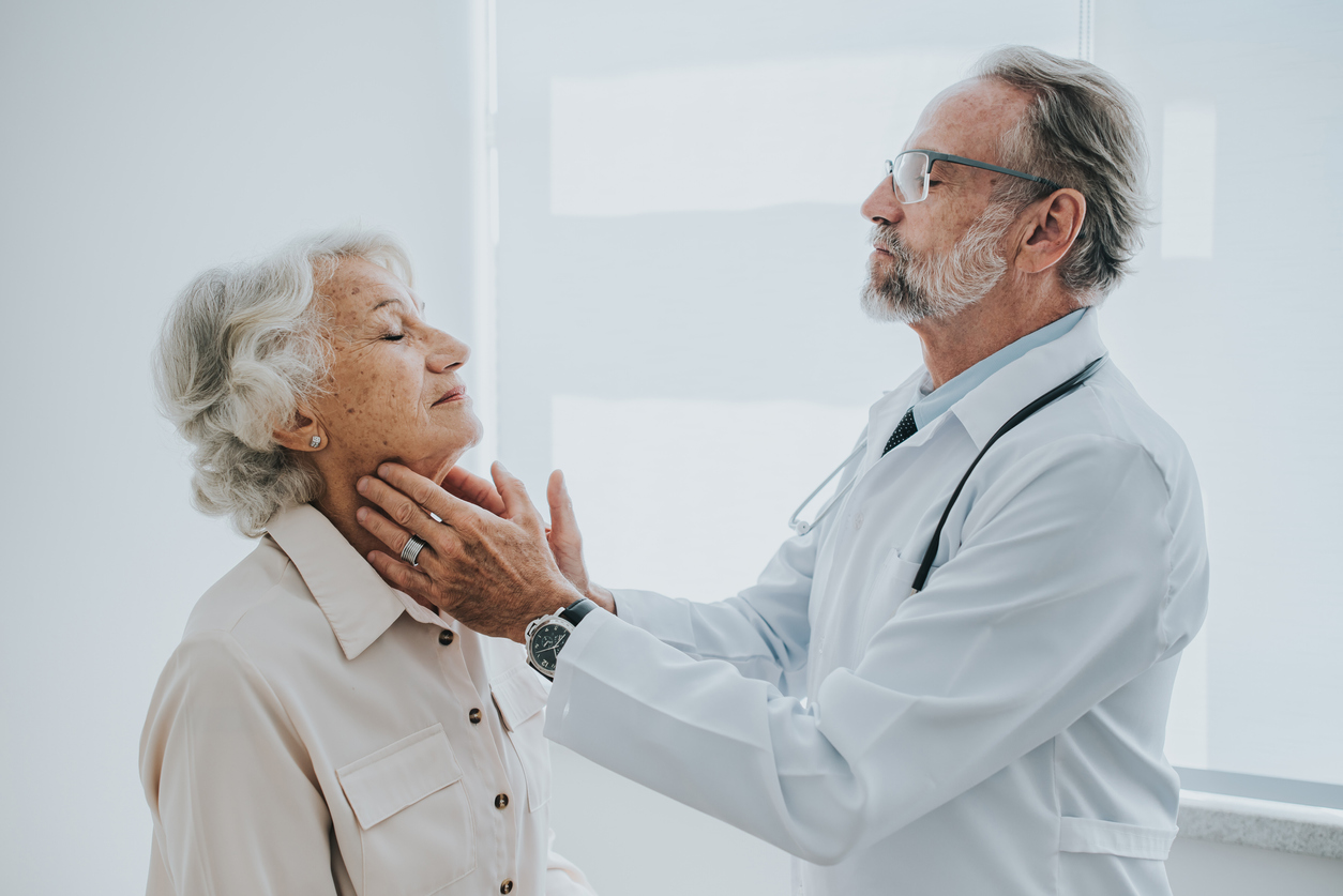 Senior patient with sore throat, doctor consultation