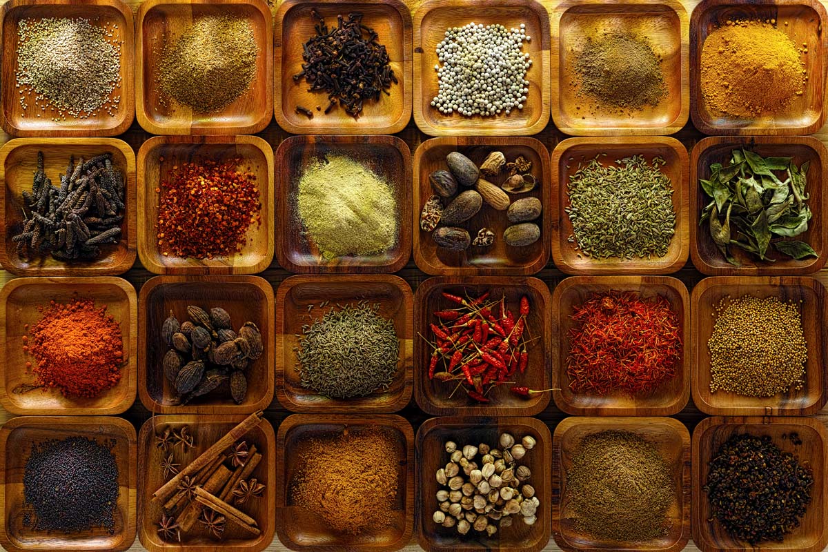 indian spices in wooden trays