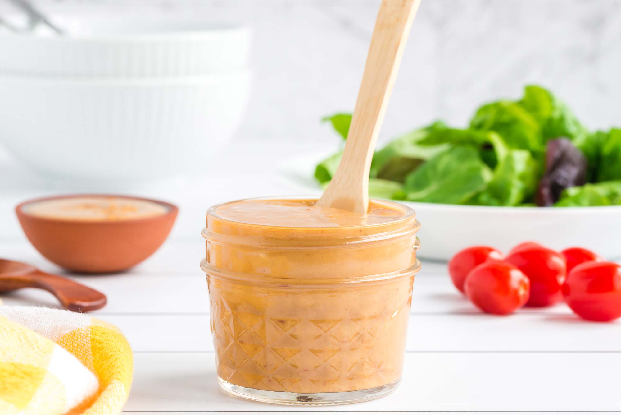 Healthy sweet and savory almond butter salad dressing