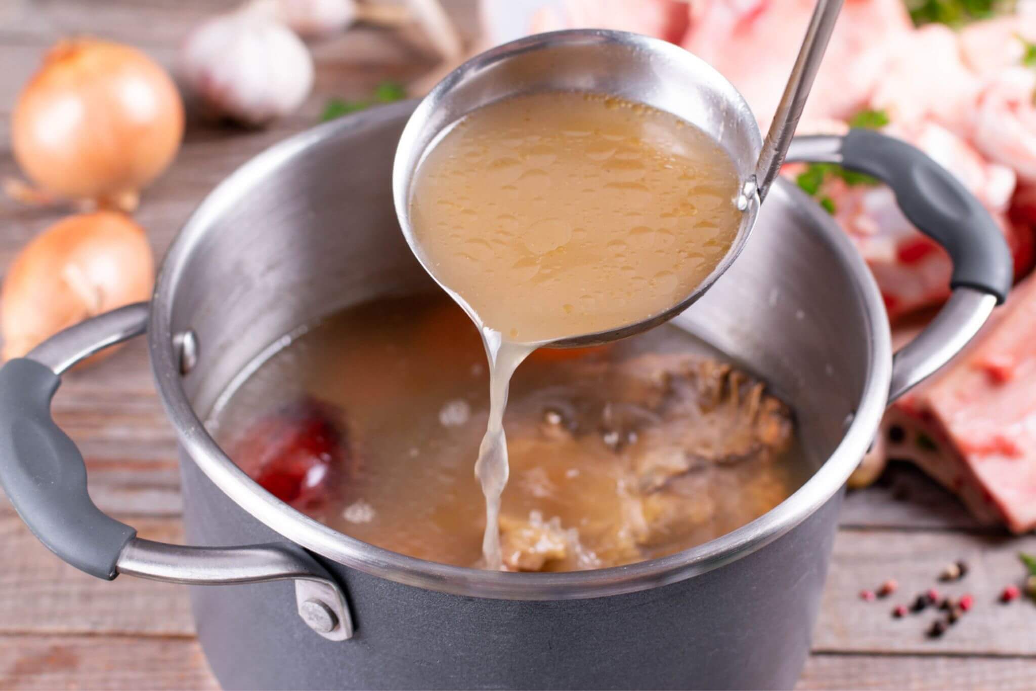 Bone Broth scoped in a ladle 